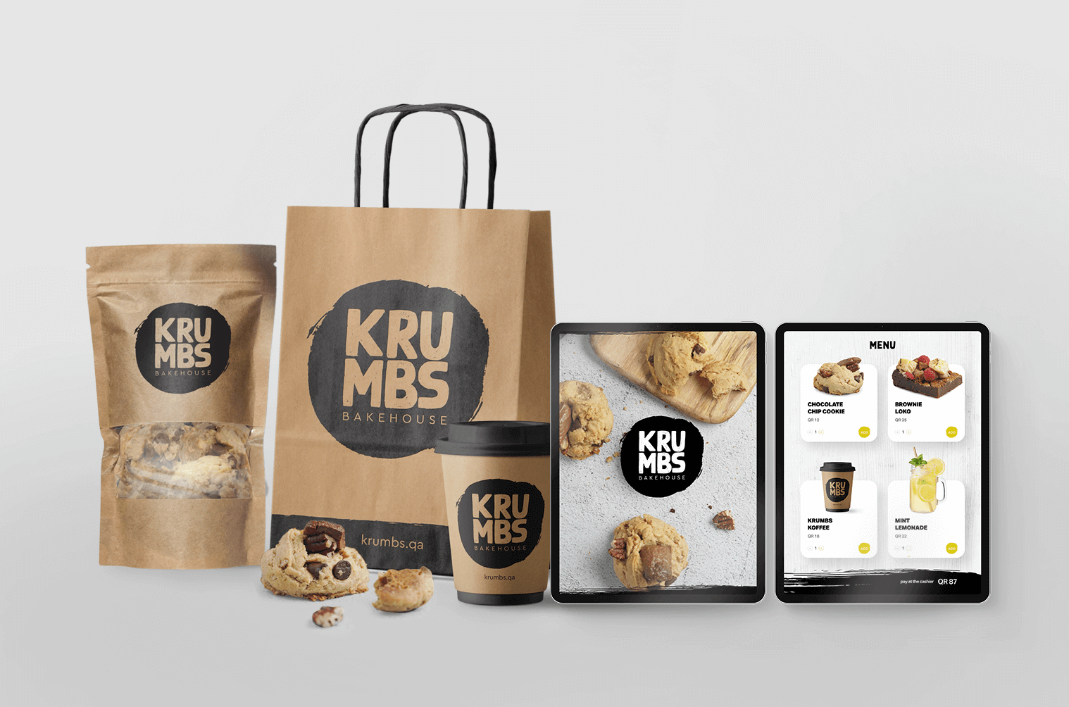 packaging of a bakeshop with cookie, coffee and a digital menu on an ipad